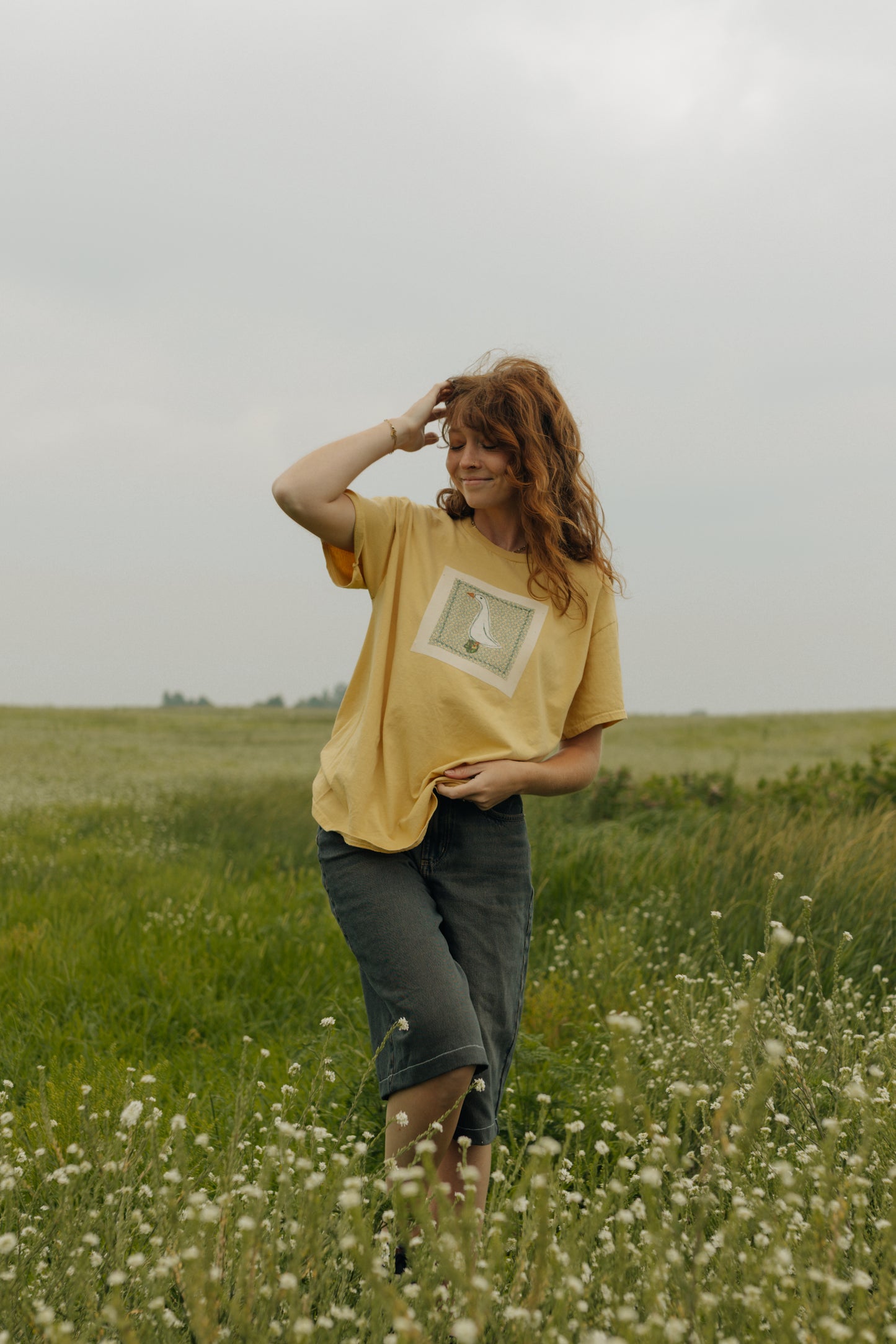 Goose patched yellow tee