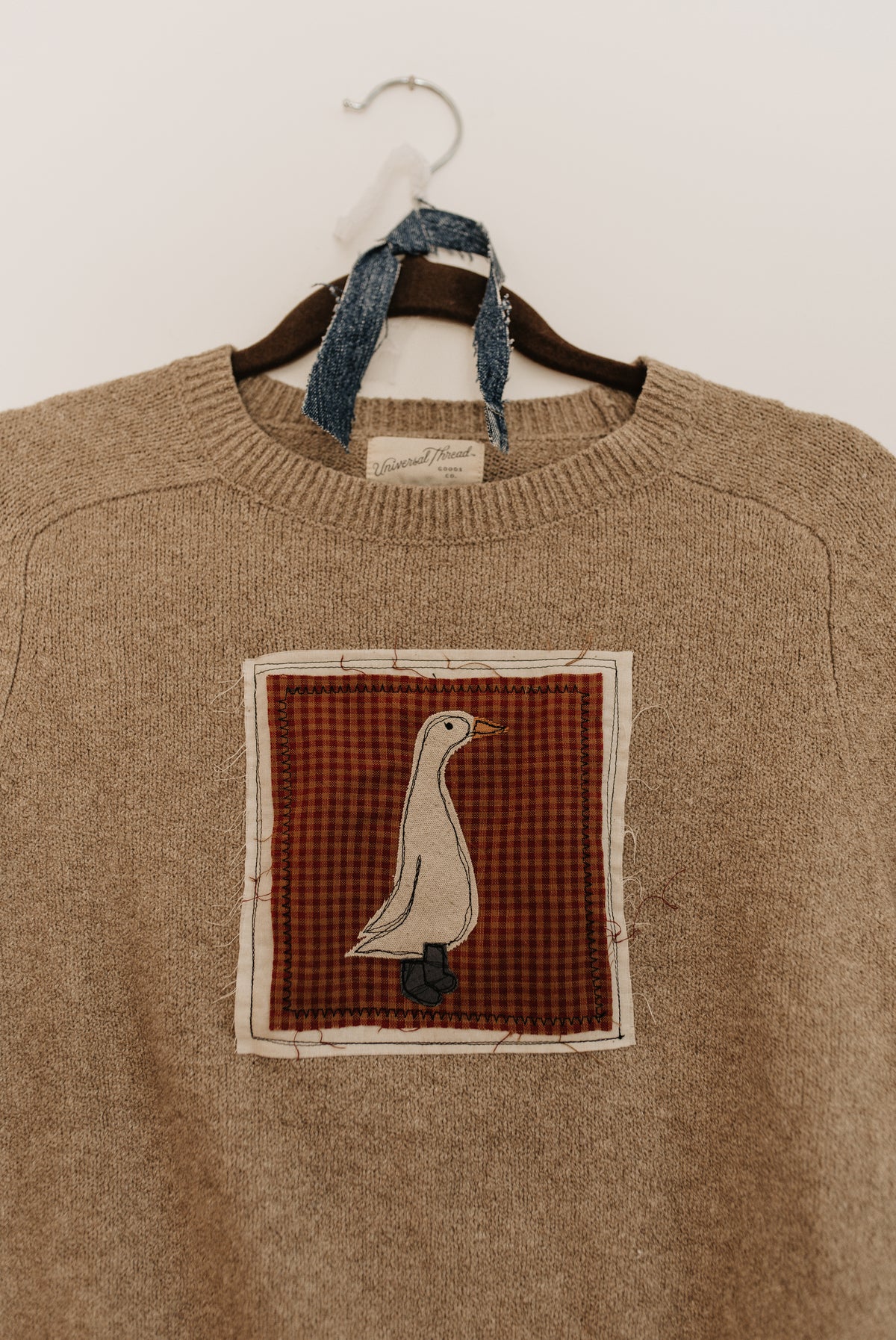 Goose Patched Tan Sweater