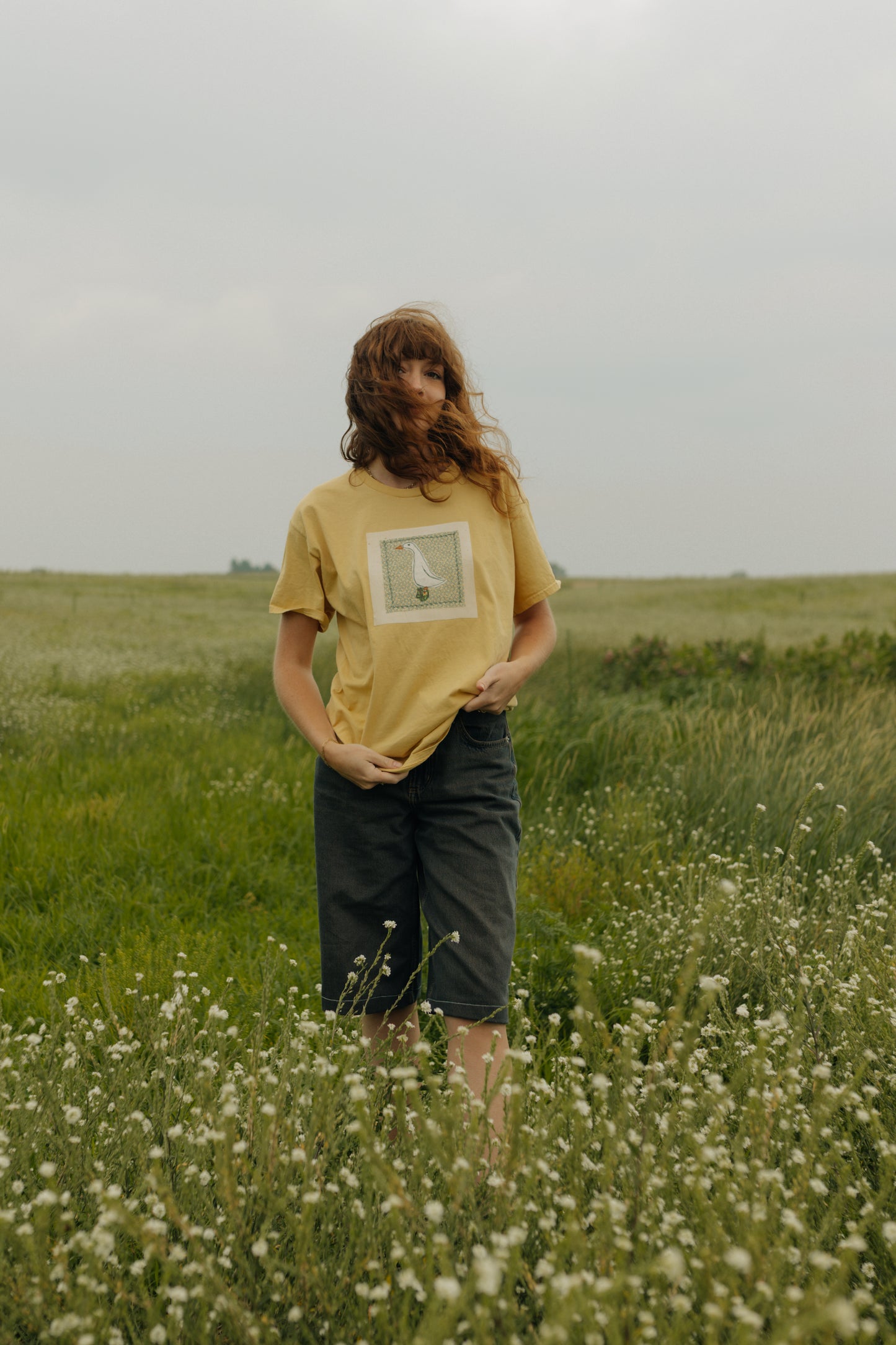 Goose patched yellow tee